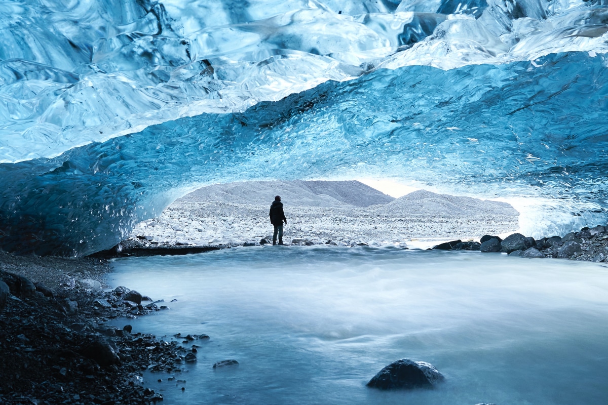 A man standing on a glacier